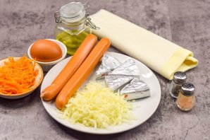 Плетеные "Хот-доги" из слоеного теста с плавленым сыром Плетеные "Хот-доги" из слоеного теста с плавленым сыром